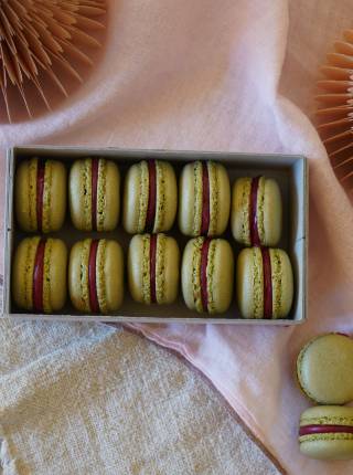 Matcha macarons with berry filling symbolic picture